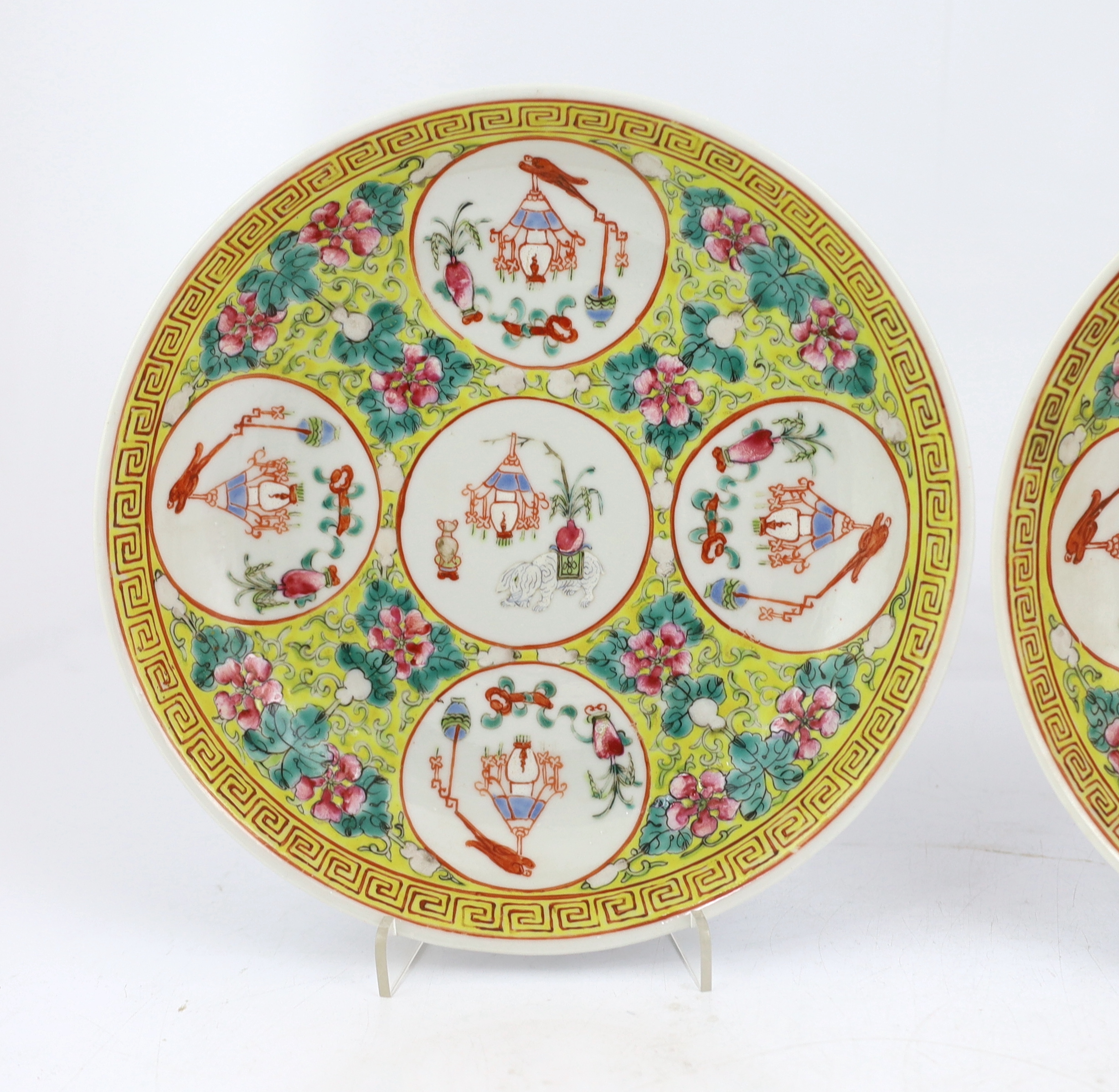 A pair of Chinese yellow ground medallion saucer dishes, Guangxu six character marks, early 20th century, hairline crack to one dish